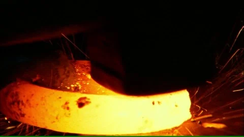 Forging-blacksmith-hammer-tool-glowing.jpg