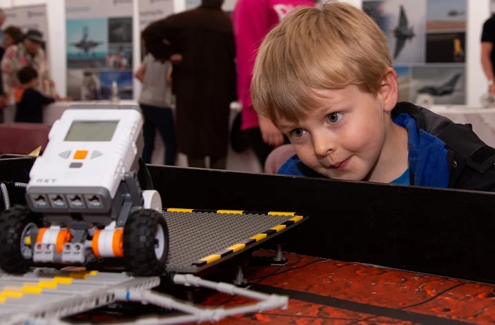 William Moore, 4 years old from Taunton learing about Robotics in the Imagineering tent (small).jpg