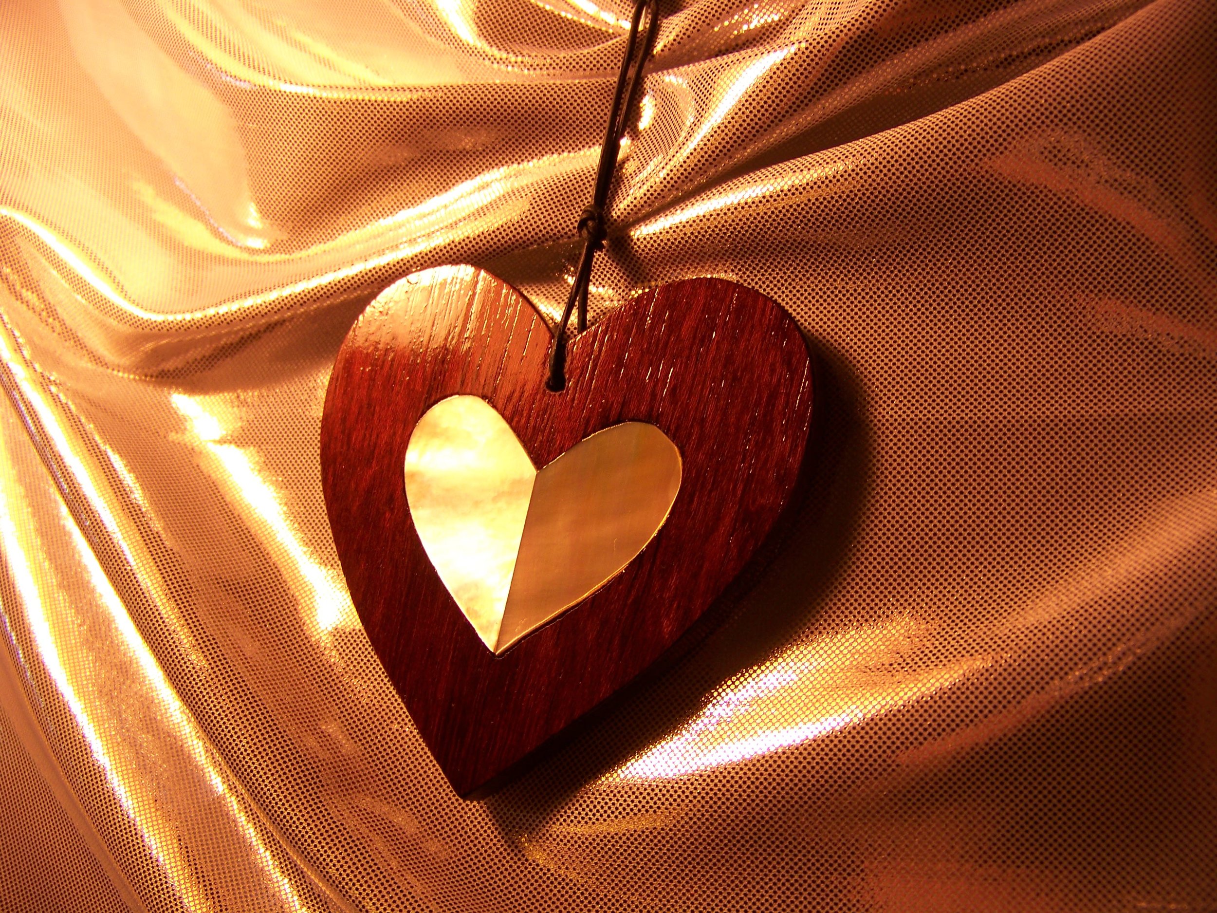 My first heart design: purpleheart wood heart with golden mother-of-pearl heart inlay (approx. 3").