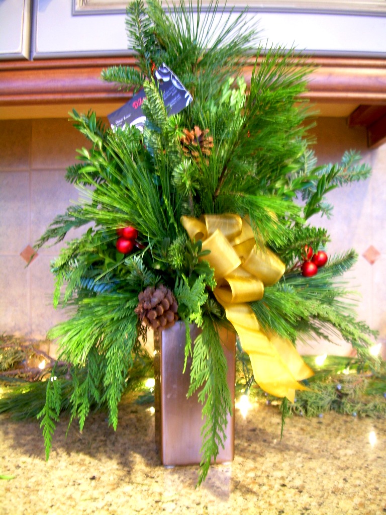 tall holiday mixed evergreen arrangement