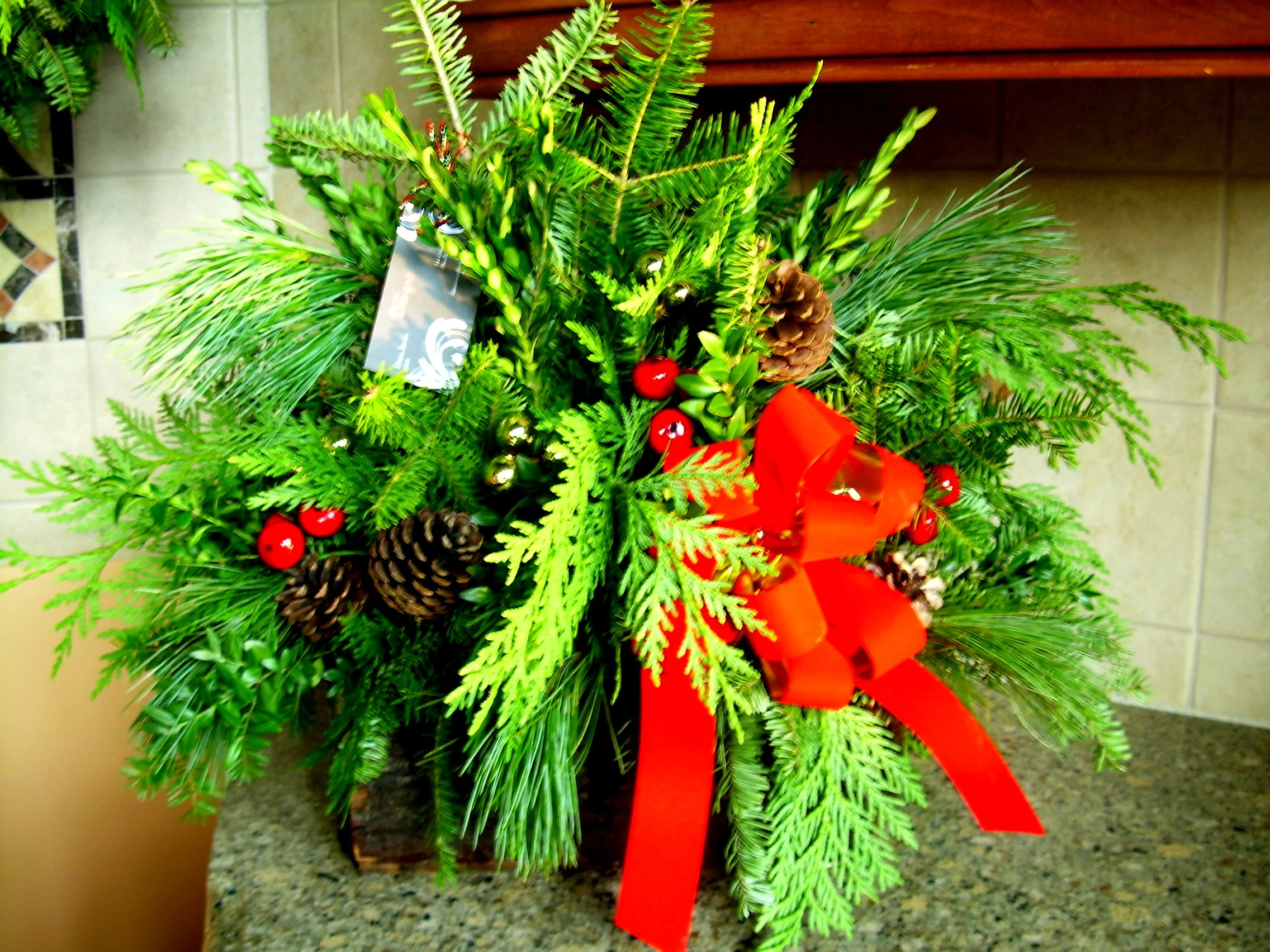 indoor/outdoor mixed evergreen log arrangement