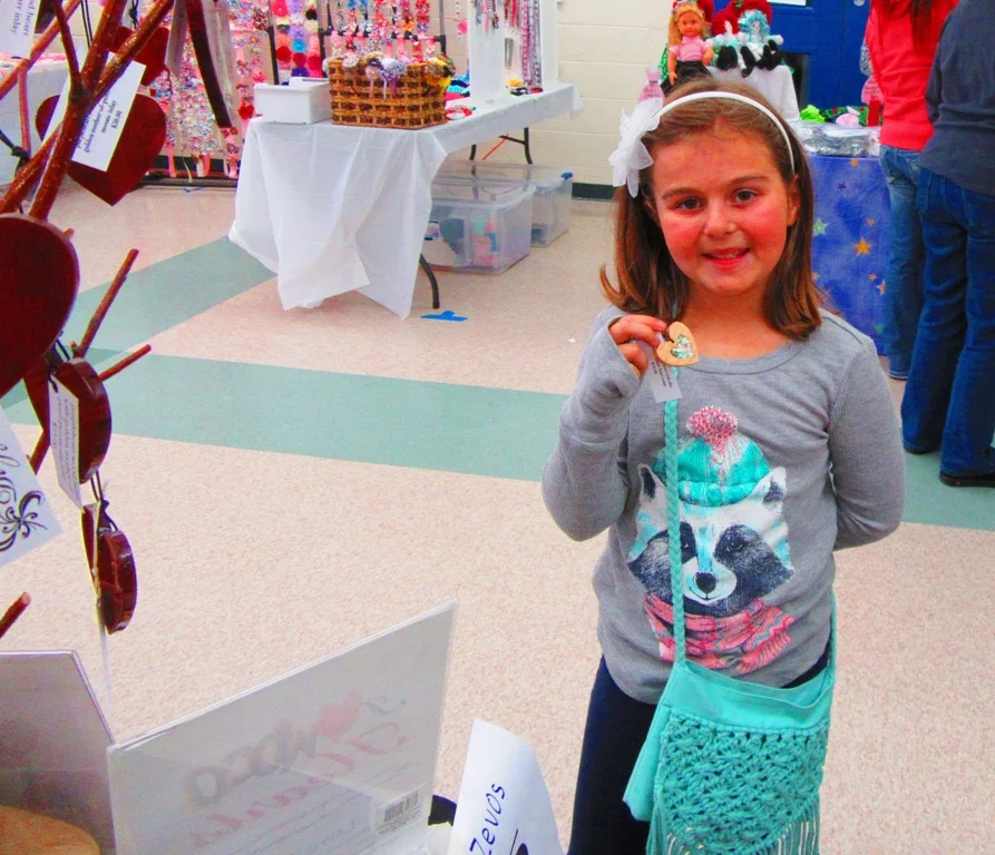 Olivia was here with her grandmother (?), who gave the ok along with Olivia to take her picture with the darling little heart she bought.