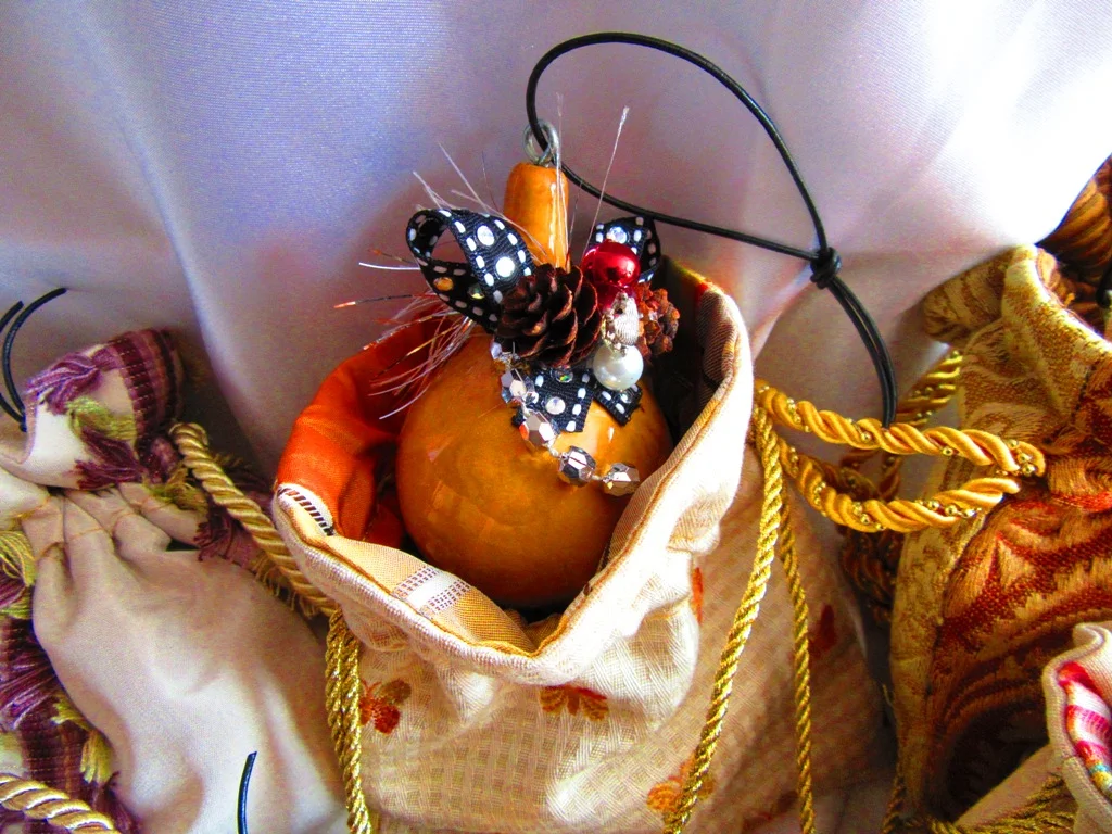 small drawstring bag with decorated gourd