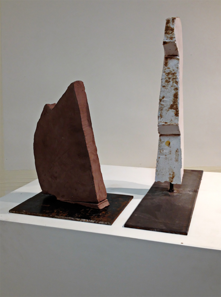  left:  Untitled , 2006 / Clay 12x7x1.5 in. right:  Totem , 2014 / Plaster and steel 18x2.5x2 in. 