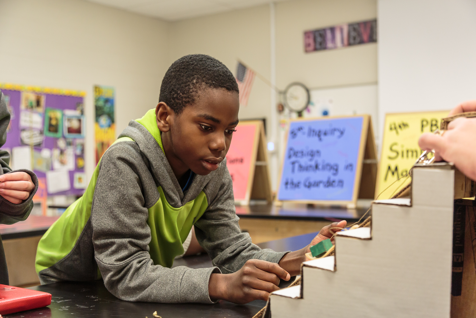   4th graders  Justin  and  Vanessa  used an inclined plane, a pulley, and a hook in their project, called Easy Box. “Basically, we’re trying to end the days of you getting hurt while trying to get a box upstairs, or valuables in the box breaking,” s