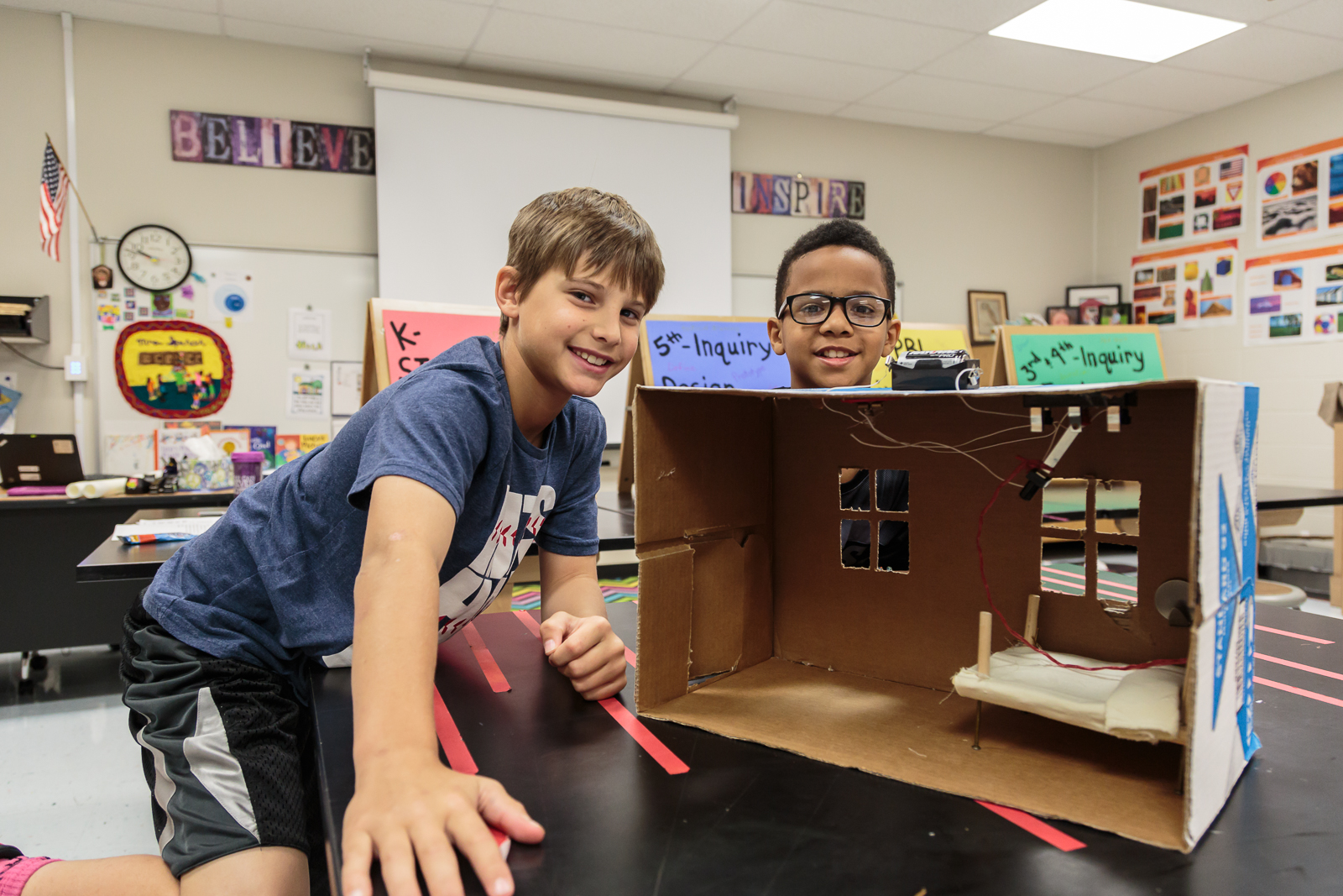   Future electrical engineer  Noah  (right) and partner  Chase , both 4th graders, designed “The Rever,” a lever to turn off the lights from the comfort of bed. “We don’t like getting out of bed [once comfortable]… to turn off the light. And then you