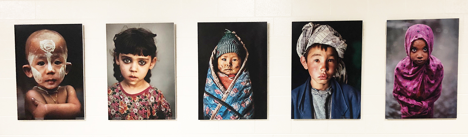 Row of five photo portraits of children