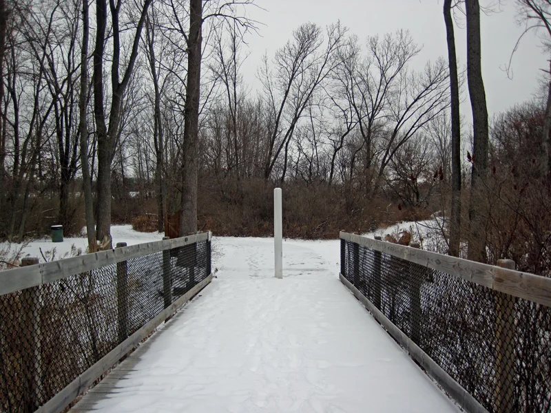 Snow-covered trail at Wilder River walk