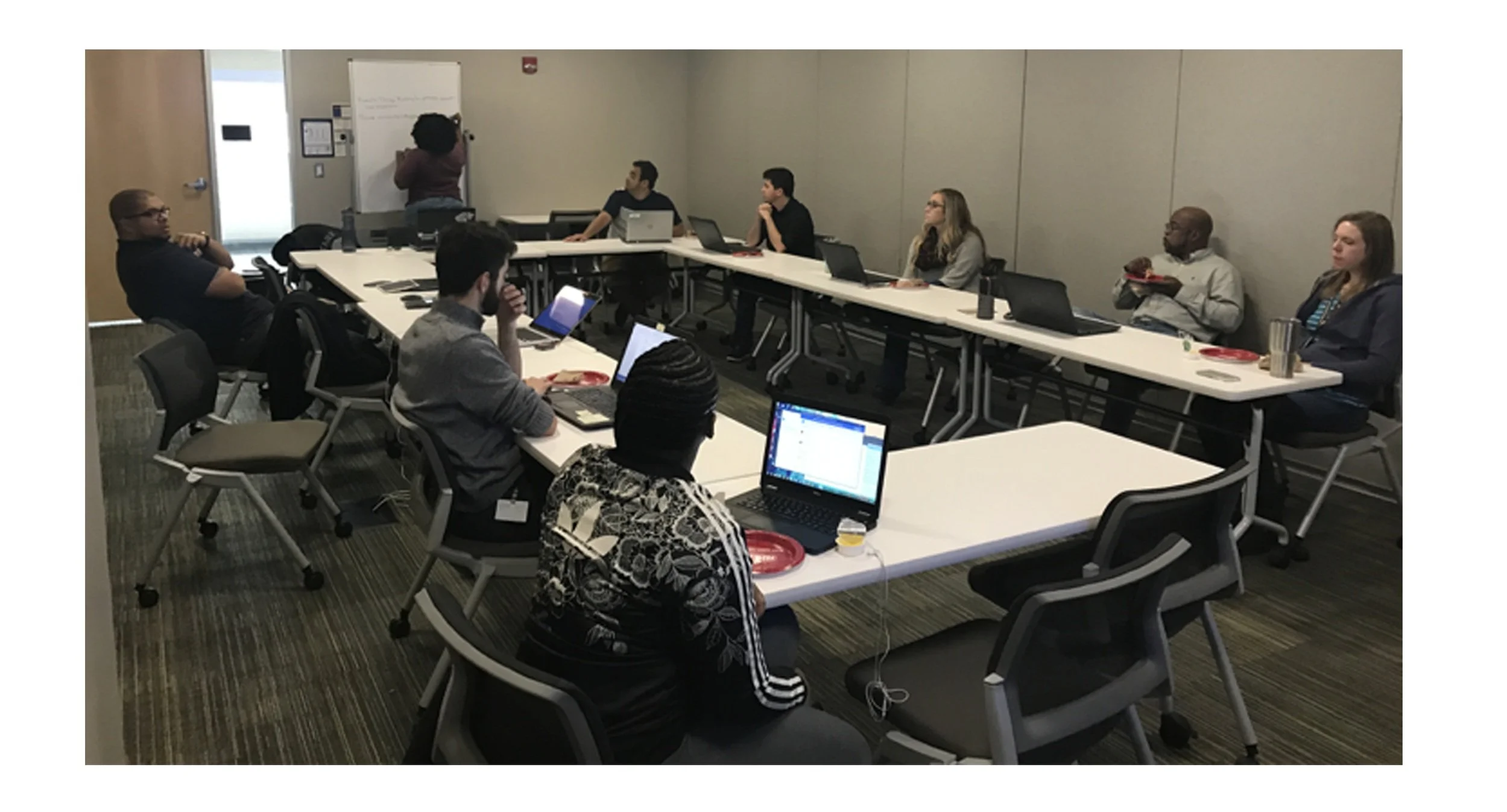 Atlanta team in a meeting sharing research findings