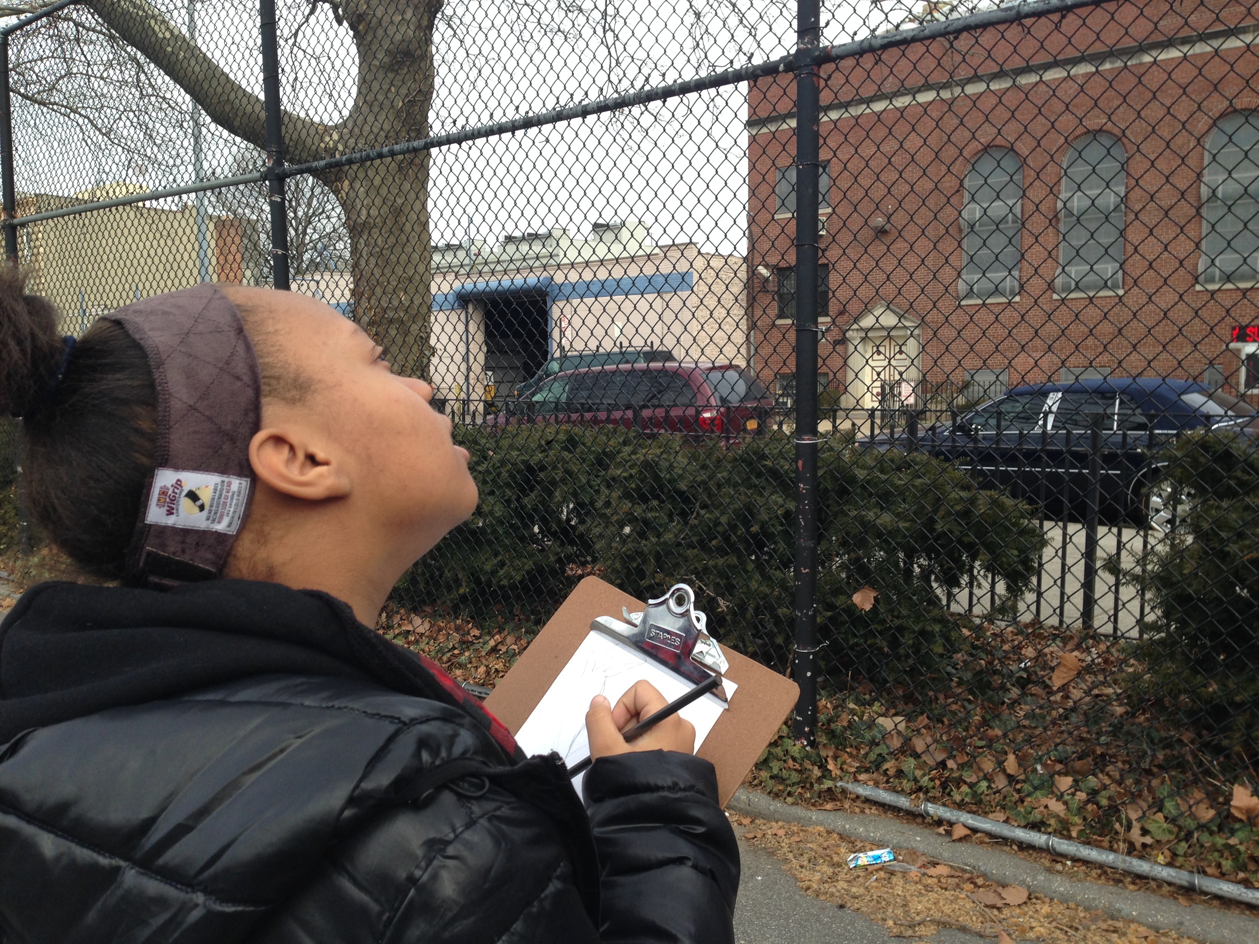 Students go outside to create landscape drawings from observation.