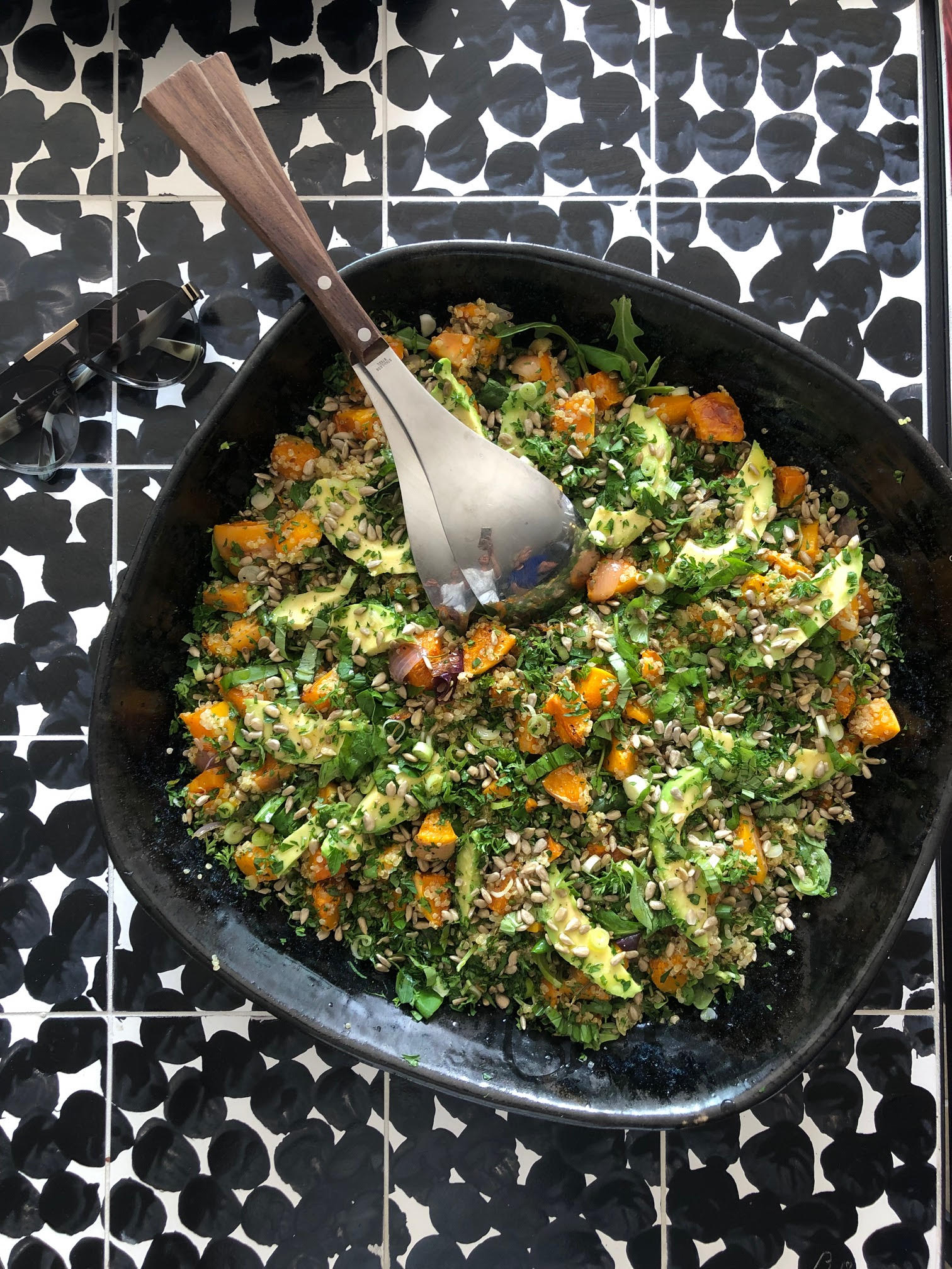 Roasted butternut squash and sweet potato salad with quinoa, avocado and lime