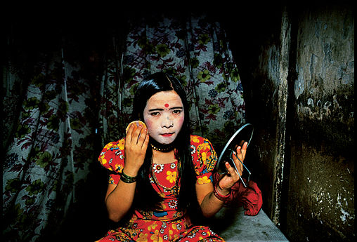The girls use powder to lighten their skin- light skin to them is more beautiful. Falkland Road, Bombay, India, 1978. Photography by Mary Ellen Mark