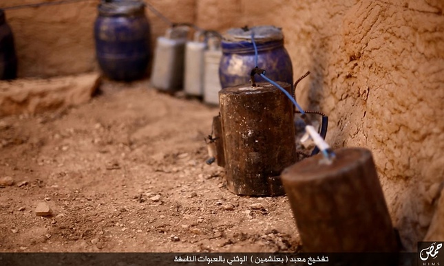 Explosives seemingly wired to the outside of the temple. Photo by ISIS /Homs region.