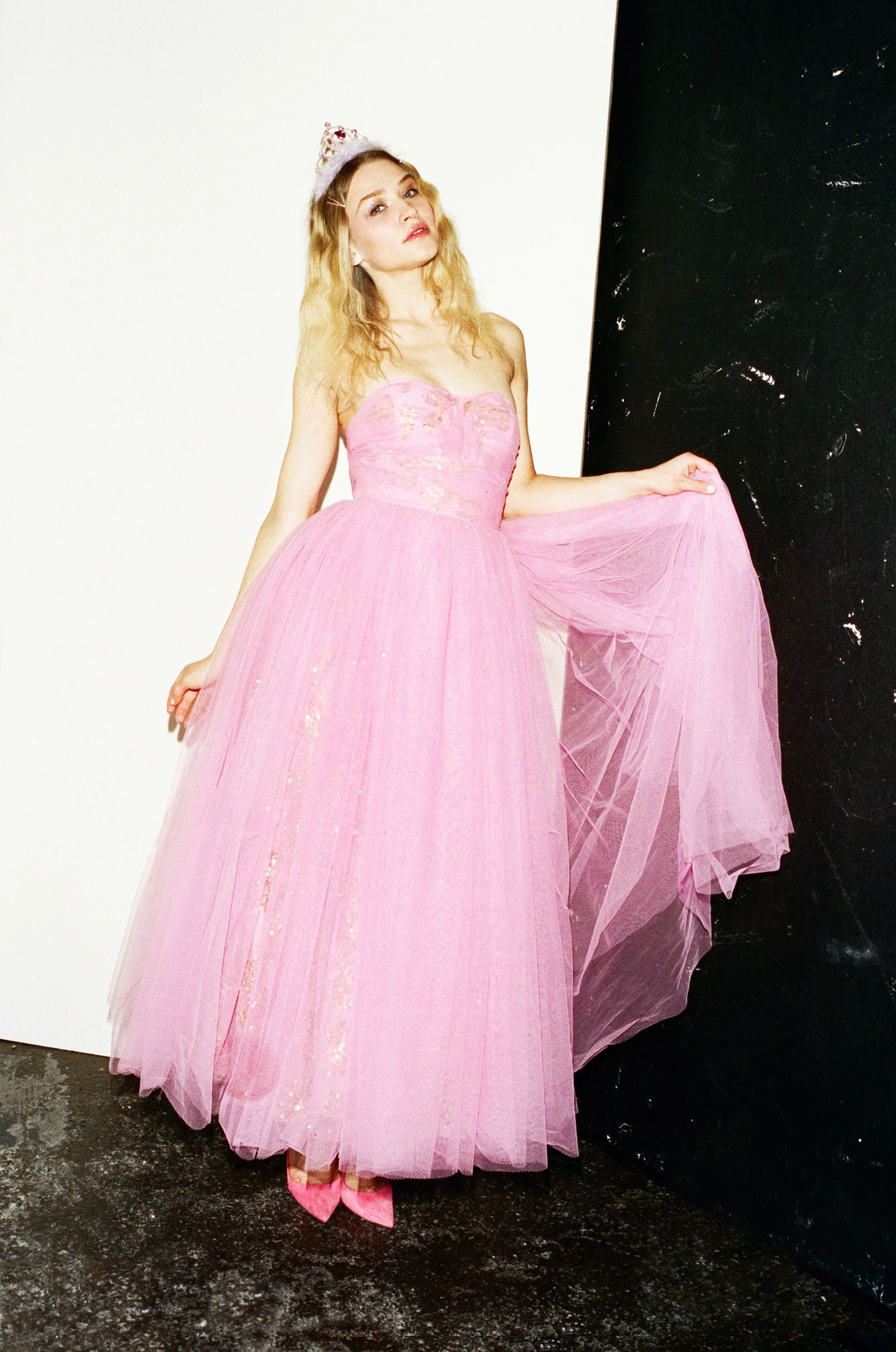 Ieva wears Pink Dress by Ashish, Pink Court Heels by Manolo Blahnik, Tiara - Stylist’s Own 