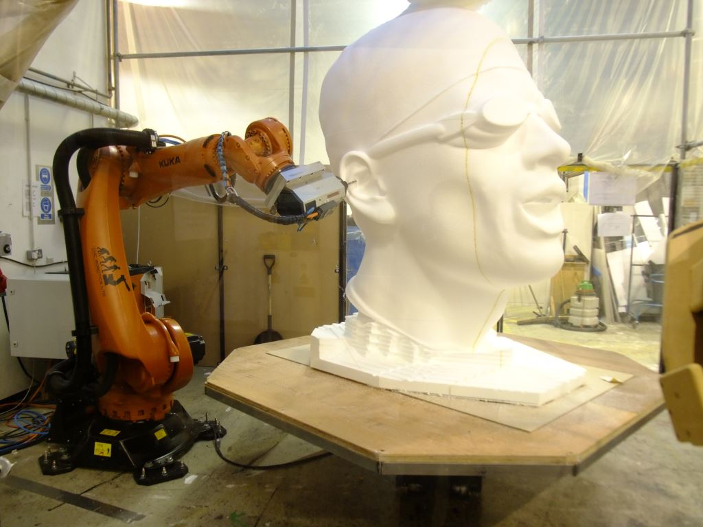 KUKA Robot arm sculpting giant swimmer's head