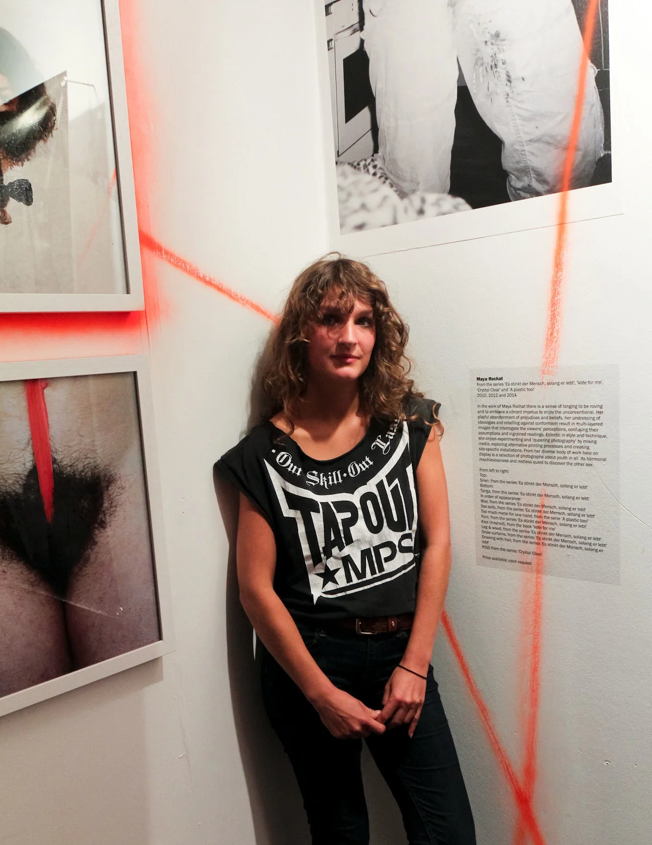 Maya Rochat, a recently graduated Swiss photographer, standing amongst the installation of three of her photographic series, from 2010 – 2014.