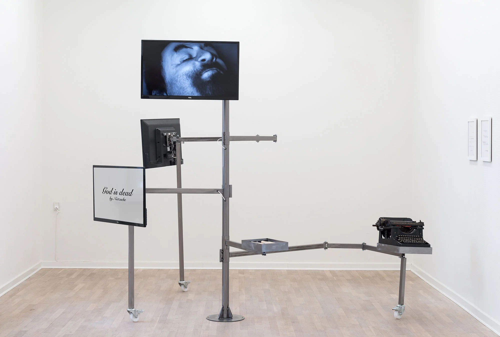 Deconstruction Structure N°1 , 2013-2014, Typewriter, hammers, A4 paper on office desk, video on flatscreen, Bilboquet game, typed sheets. Courtesy of the artist and Goodman Gallery, Johannesburg-Cape Town. Exhibition view from Merchant of Dreams. Photo credit : Viborg Kunsthal