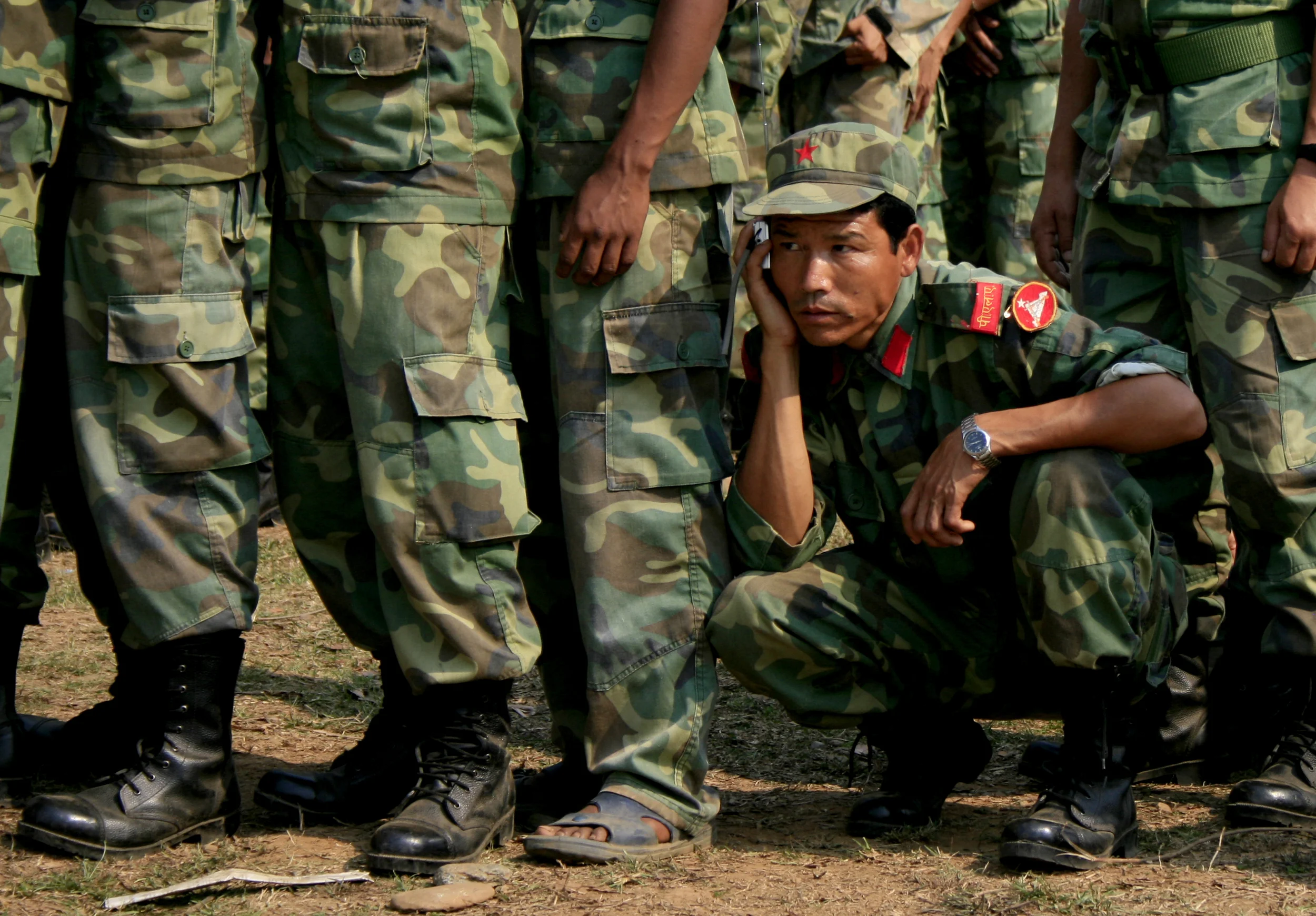 Maoist soldier listens to radio news updates attentively during the Nepalese constituent assembly election, 2008. Photo by Rashmi Thapa