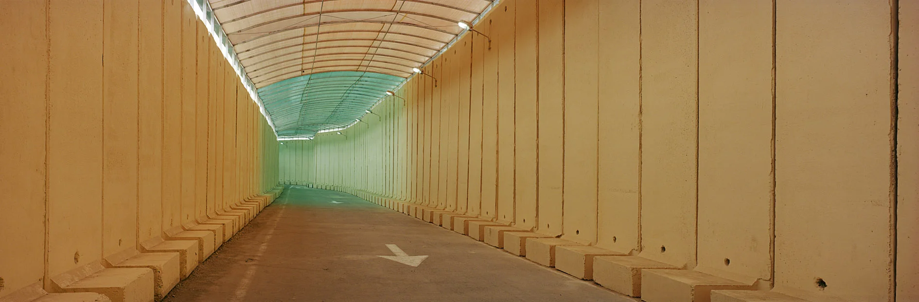 High security entrance and exit to the Gaza Strip in Eretz Checkpoint. The building was finished in early 2005. Than about 1500 Palestinians from Gaza hold a permit to enter Israel out of a total population of 1,4 million in the strip. The tunnel was destroyed by the Israeli army in the war at the turn in 2009.