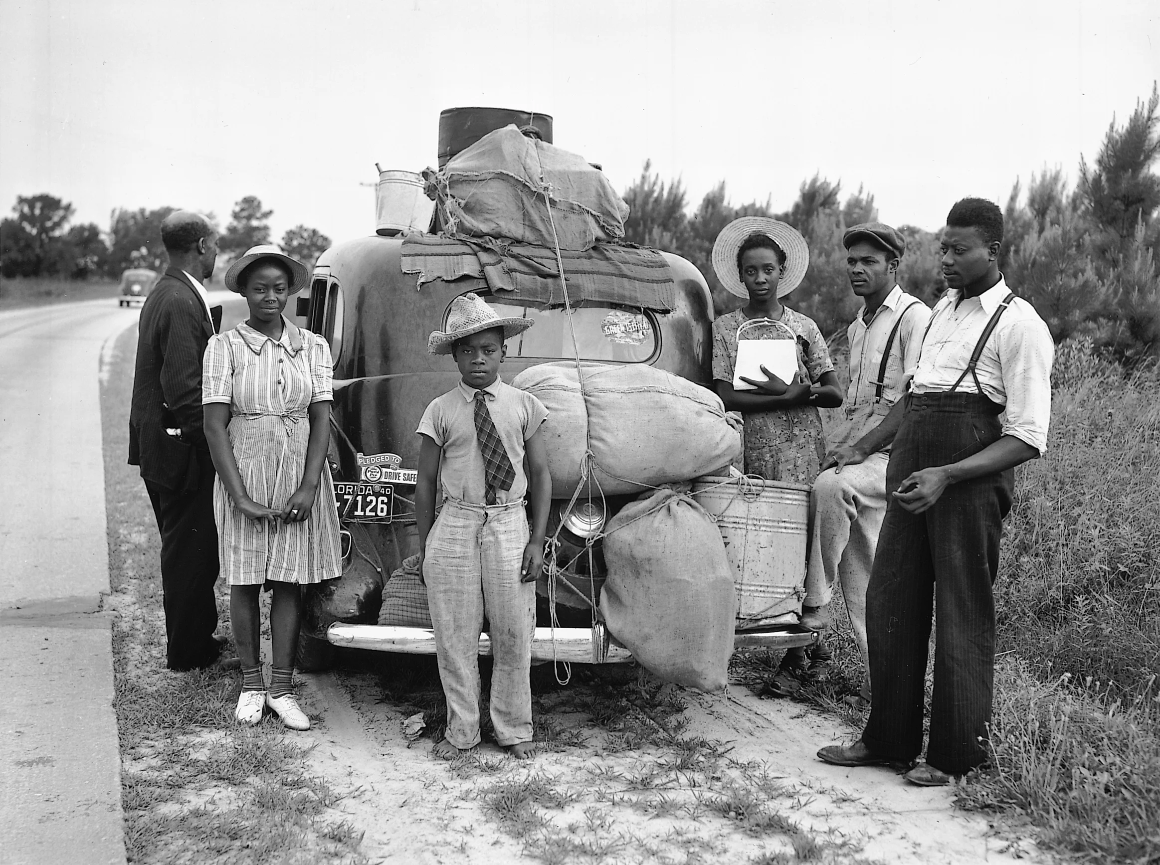 A group of Florida migrants on their way home to Cranberry. New Jersey, July 1940. Photography by Jack Delano.