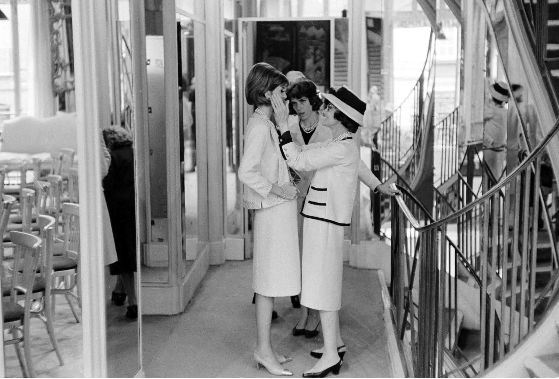 Coco Chanel with model preparing for the new collection. Paris, France 1962. Photography by Douglas Kirkland