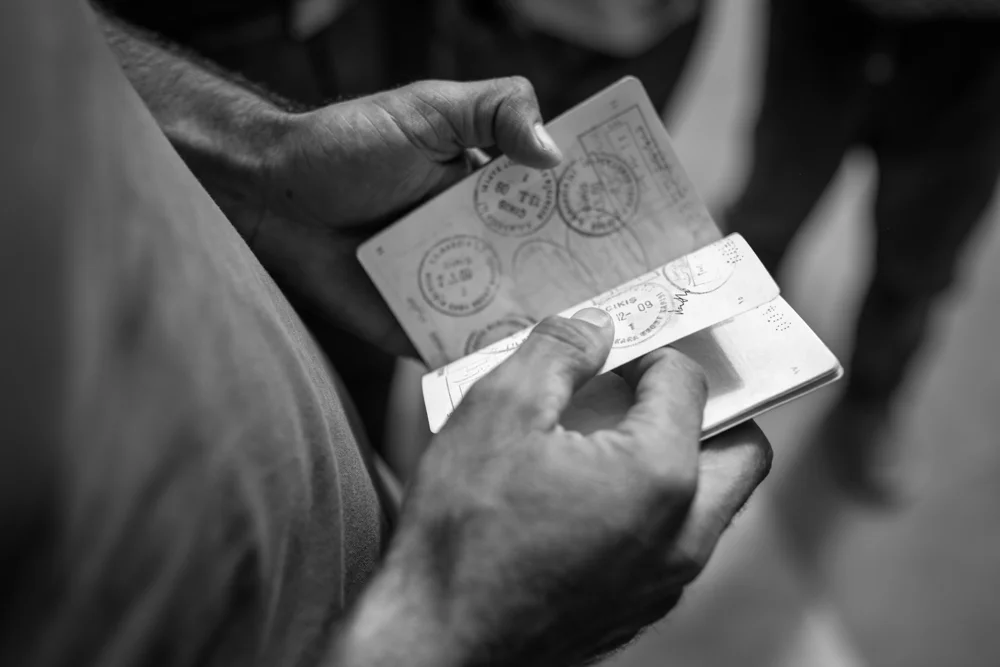 A Syrian refugee shows multiple Turkish entry stamps in his passport. Istanbul, Turkey. September 16, 2015. Photo by Miguel Winograd.
