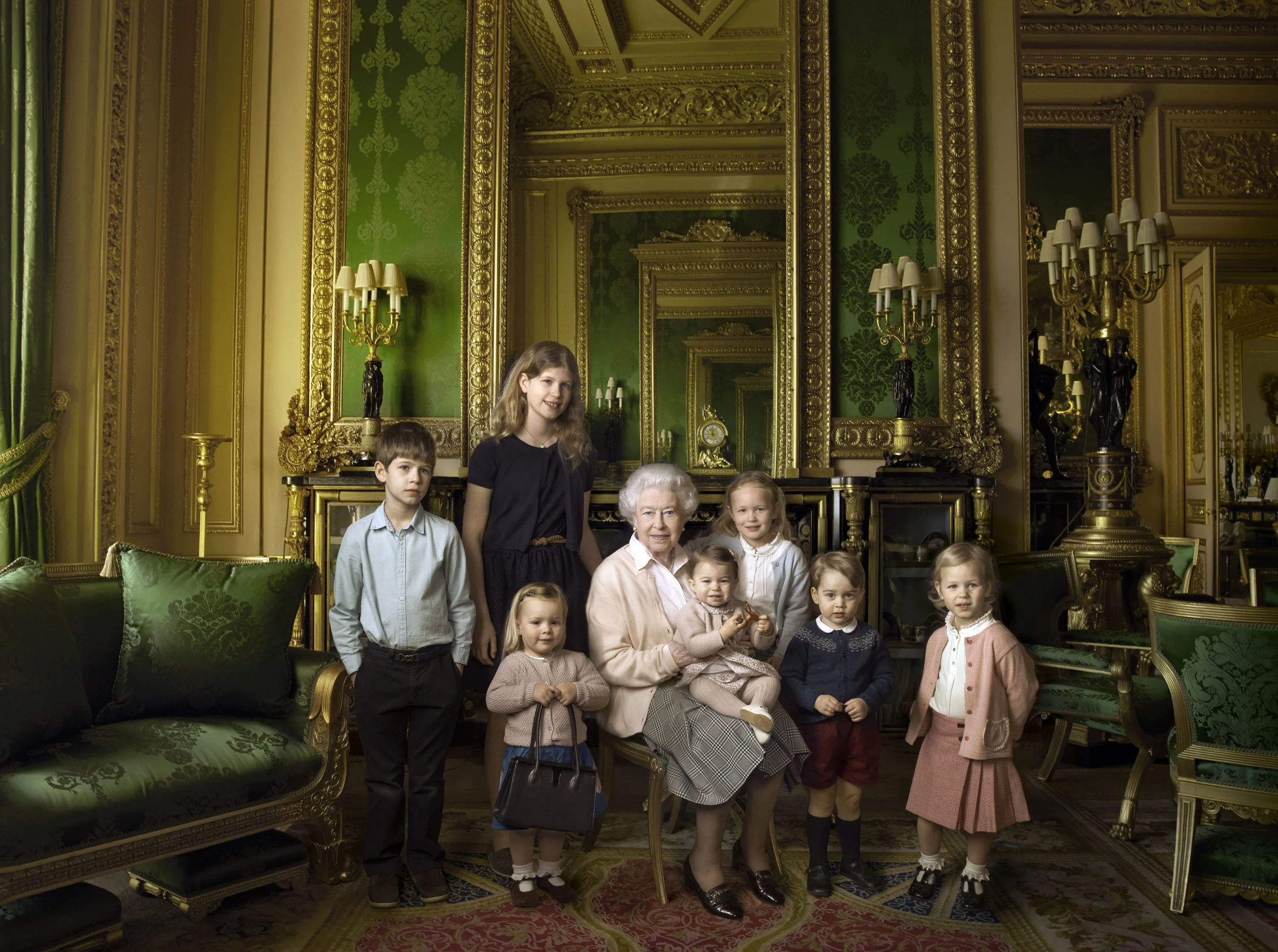 Queen Elizabeth II surrounded by her five great-grandchildren and her two youngest grandchildren. Photo by Annie Leibovitz/PA Wire, 2016.