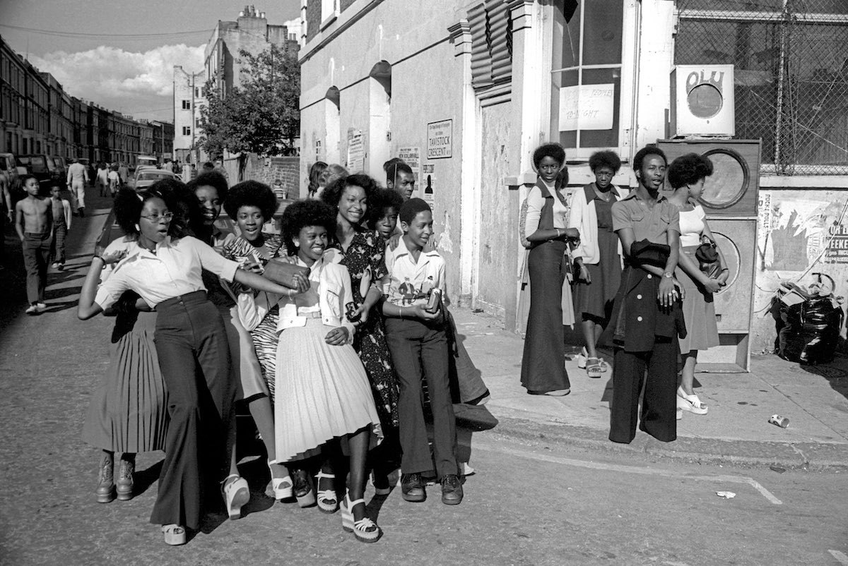Group of girls standing on the corner of Portobello Road at Notting Hill Carnival, 1975. Photo source: PYMCA Archive.
