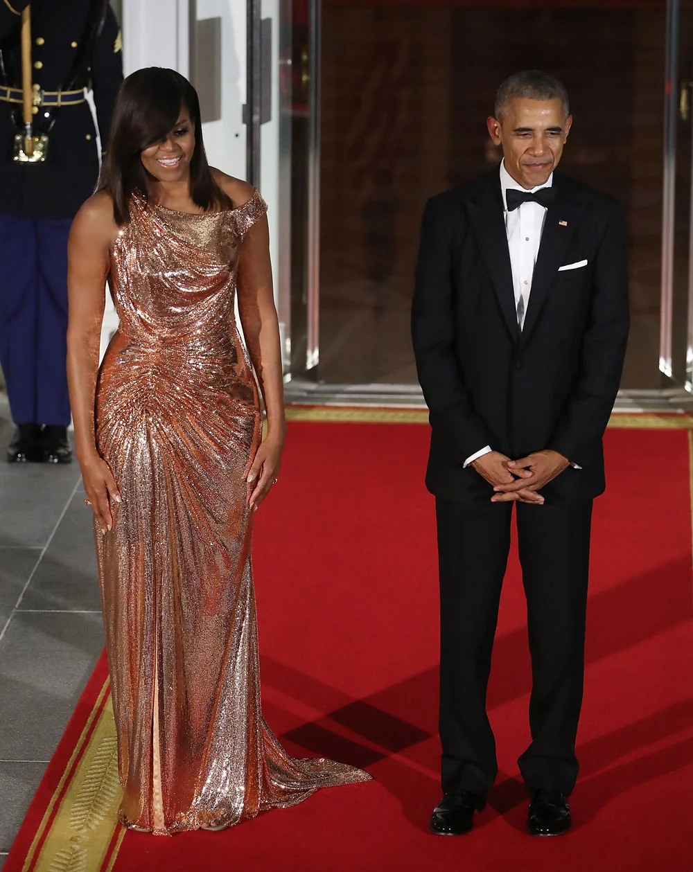 Michelle Obama and Barack Obama at the White House state dinner, 2016. She wears a custom dress by Versace. Photo source: Getty Images.