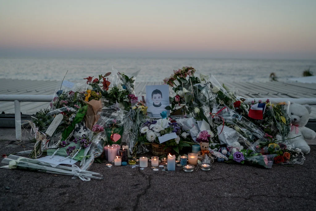 A memorial to a child killed during an attack on Bastille Day, when a man in a cargo truck ran over hundreds of people. Photo by Andrew Testa.