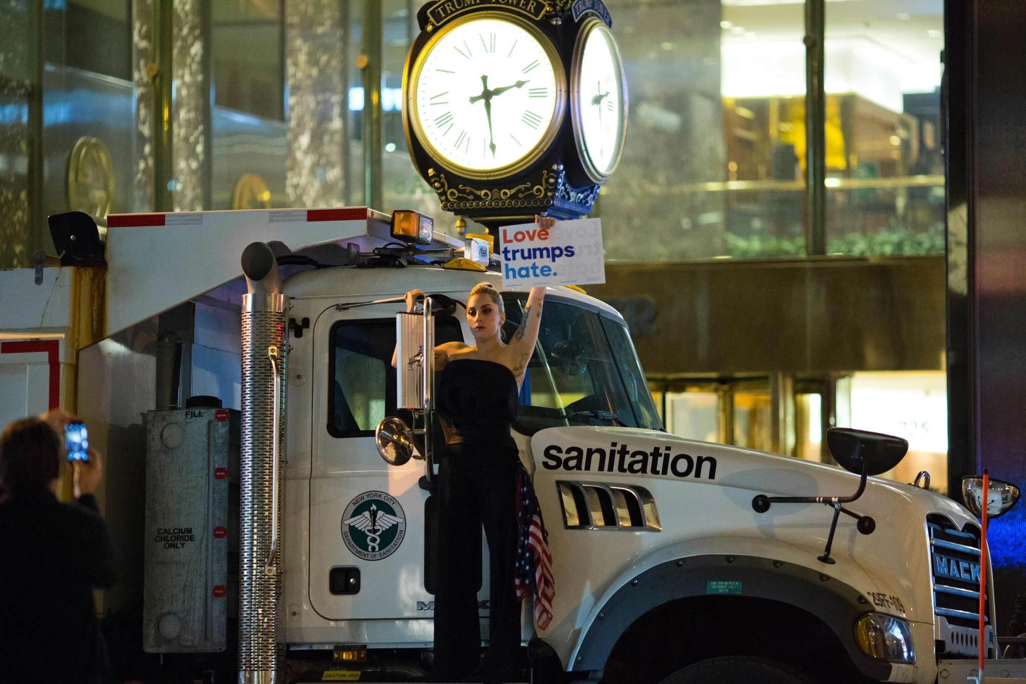 Lady Gaga stages a protest against Donald Trump on a sanitation truck outside Trump Tower in New York City after midnight on election day November 9, 2016. Photo source: AFP.