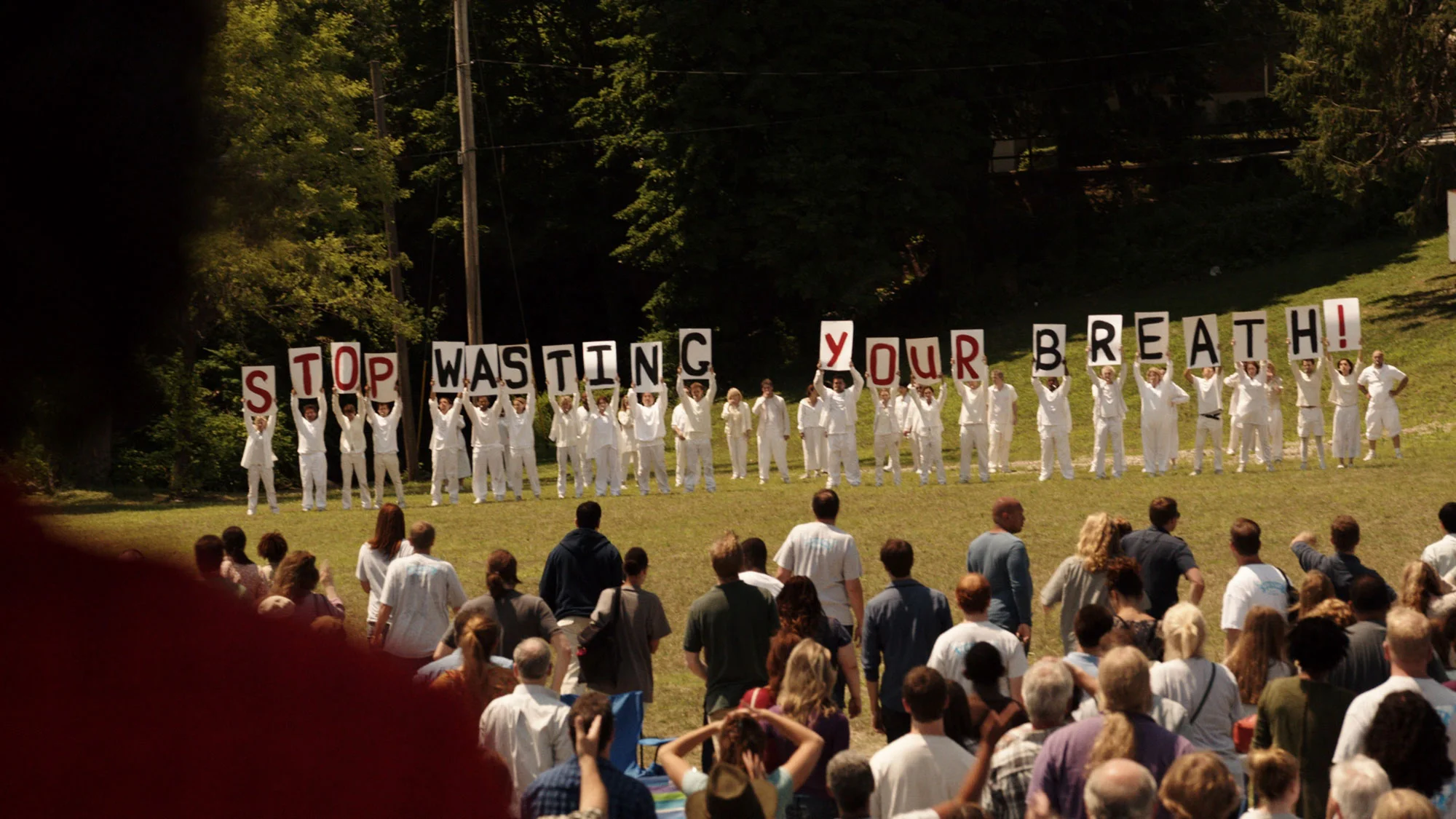 The Guilty Remnants holding up a message in a scene from The Leftovers. Photo source: HBO.