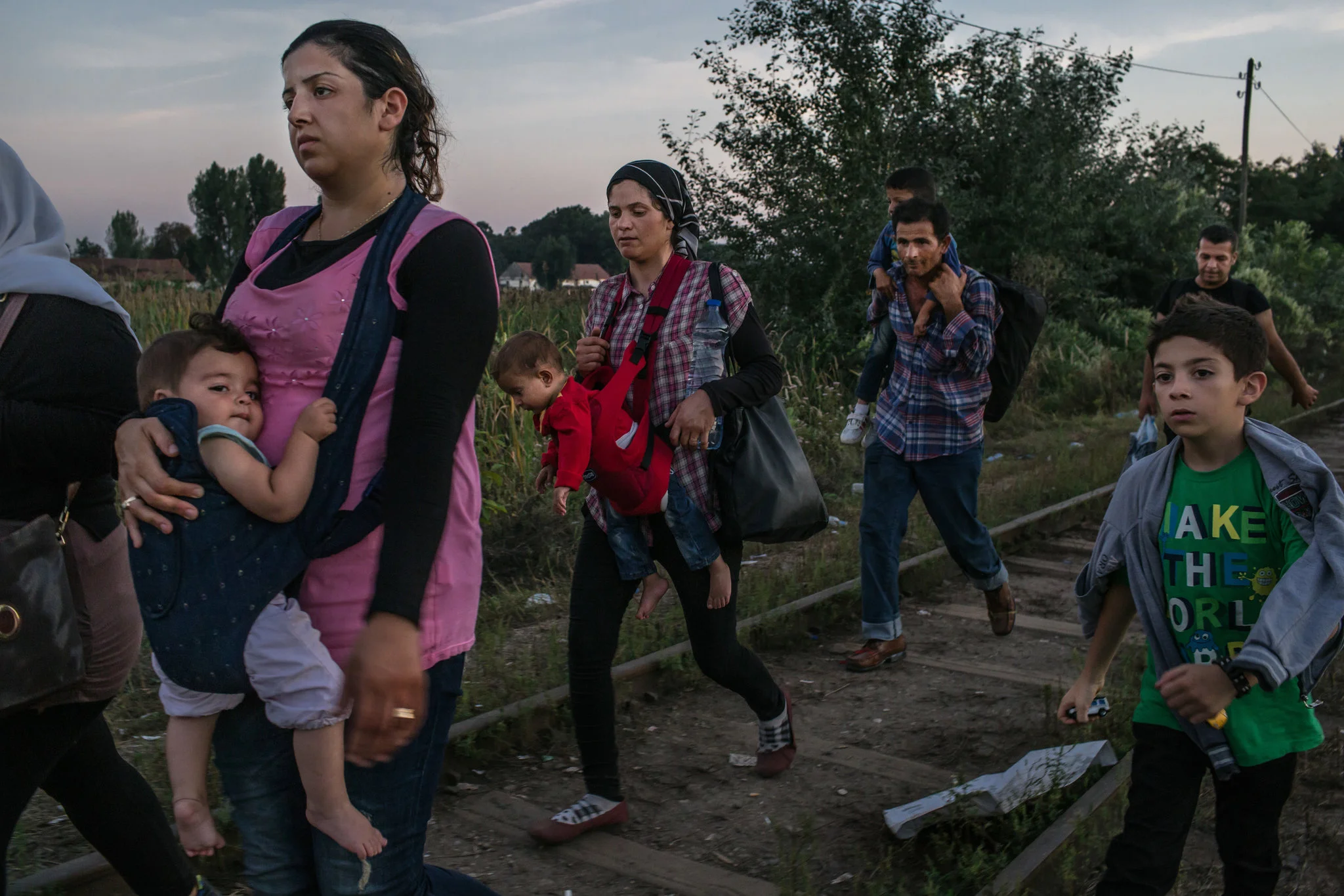 Syrian refugees make their way along railroad tracks toward the Hungarian border near Horgos, Serbia. Mauricio Lima for The New York Time .