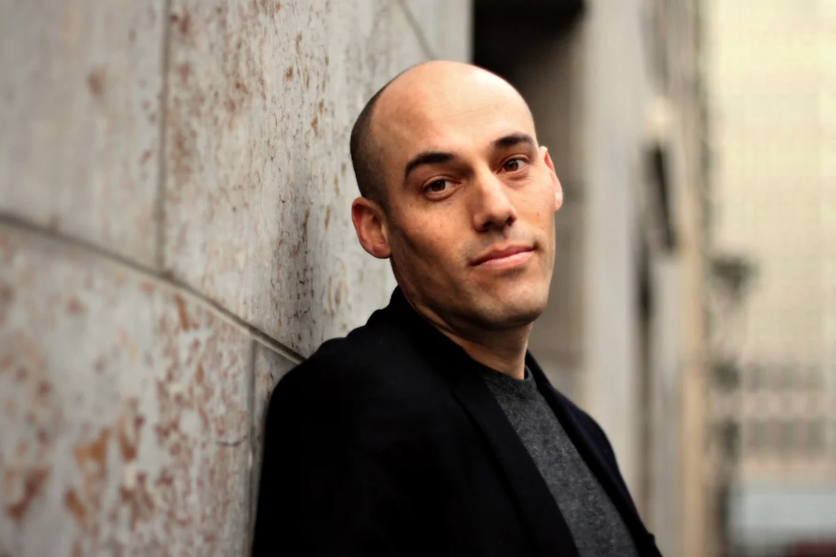 Joshua Oppenheimer. Photo by Oliver Clasper for Drafthouse Films. Source: Interview Magazine.