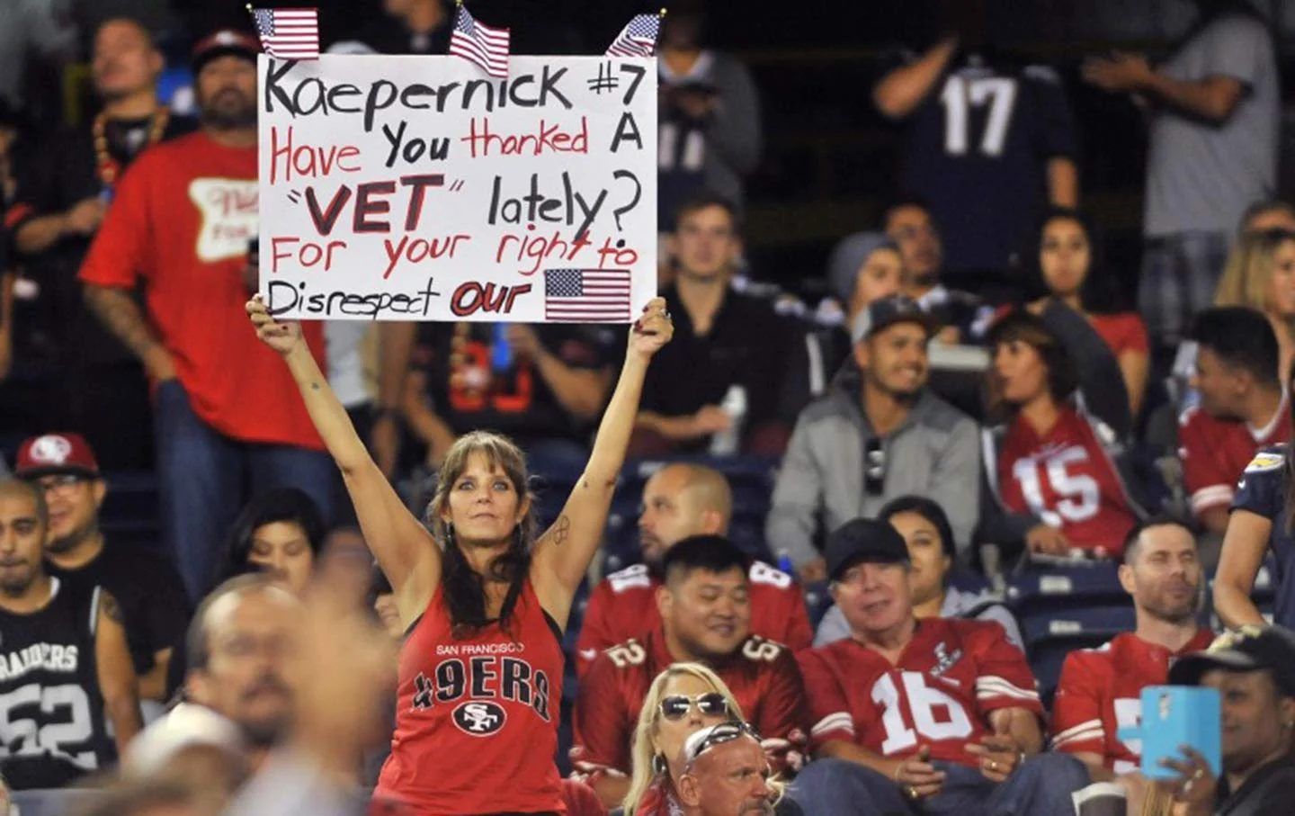 A San Francisco 49ers fan holds up a sign in reference to quarterback Colin Kaepernick during the second half of the game against the San Diego Chargers at Qualcomm Stadium. Photo Credit: Orlando Ramirez/USA Today Sports.