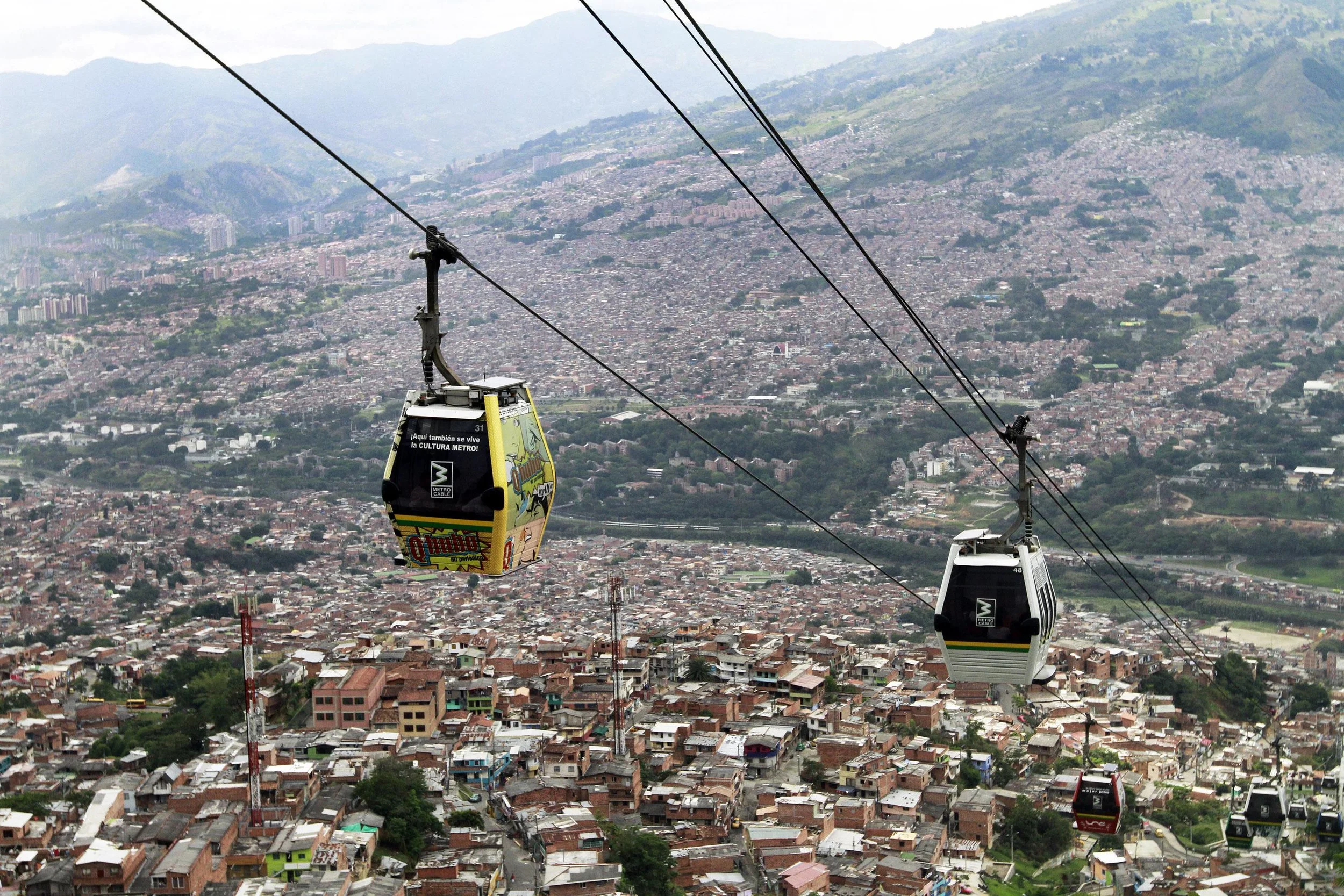 Cable cars pass above the town of Medellín, Colombia. Photo by Albeiro Lopera/Reuters.