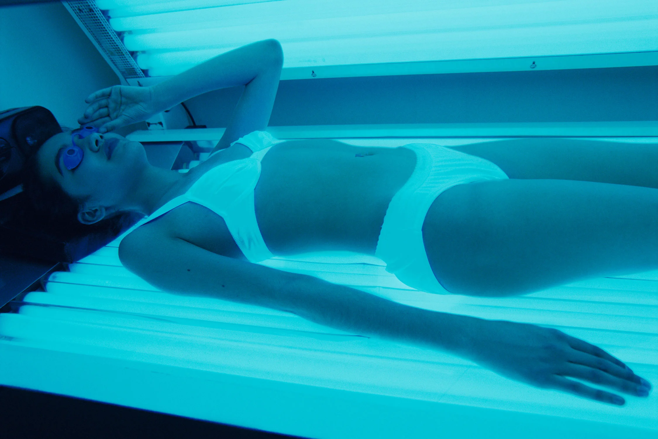 Fina, 13, in the tanning salon, Edina, Minnesota, from series Girl Culture by Lauren Greenfield.