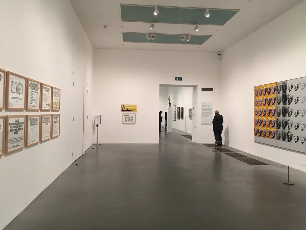 Exhibition view: Guerrilla Girls and Andy Warhol at Tate Modern, 2018.