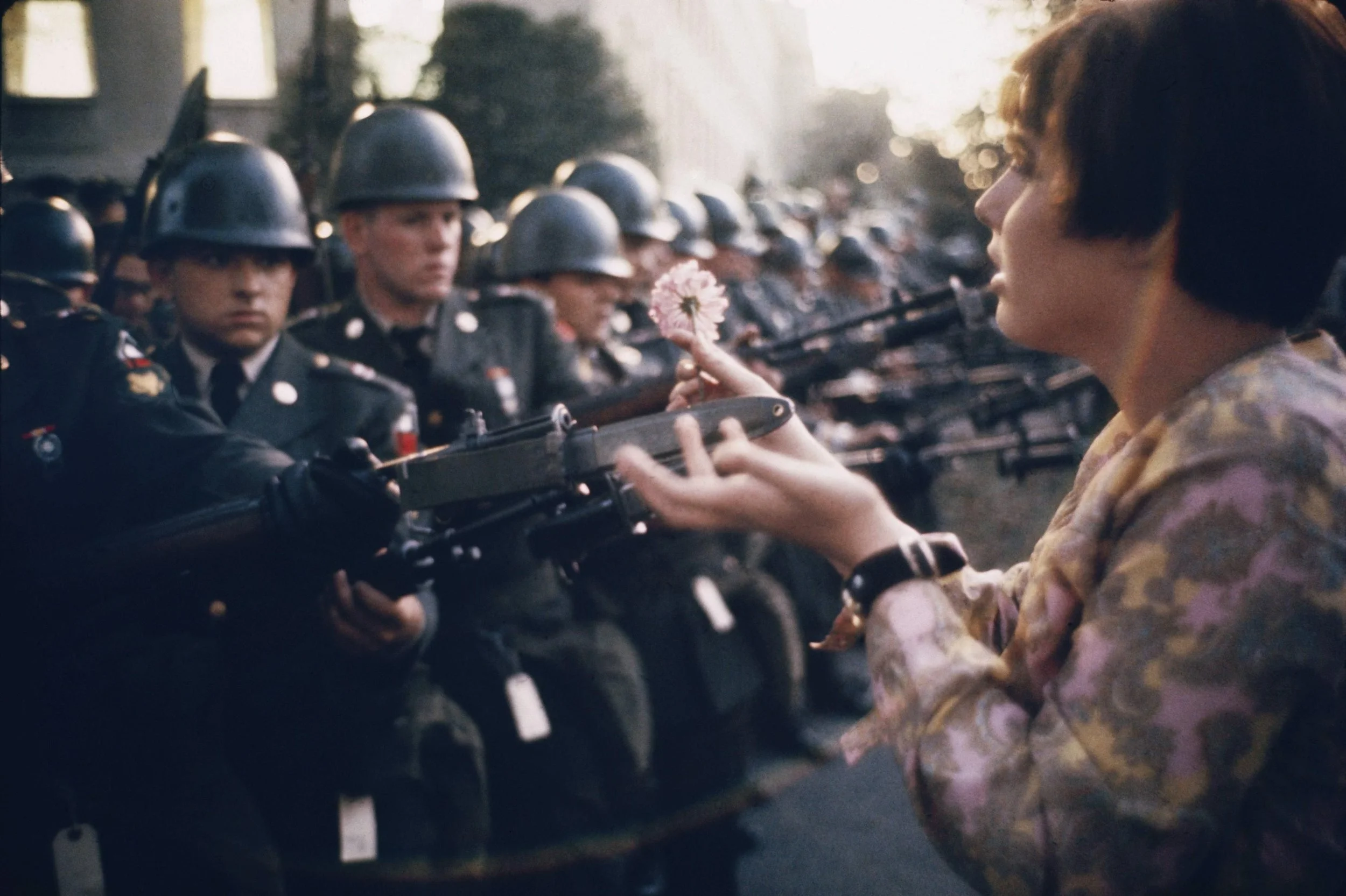 Jan Rose Kasmir confronts the American National Guard outside the Pentagon in Washington during the 1967 anti-Vietnam march. Photo by Marc Riboud.