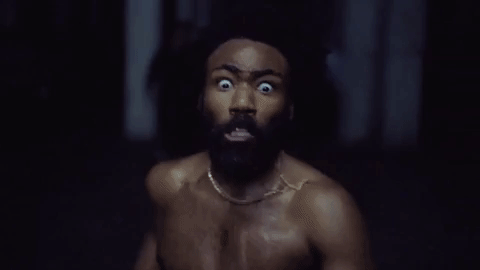 Childish Gambino being chased and running in the last scene of 'This is America'.
