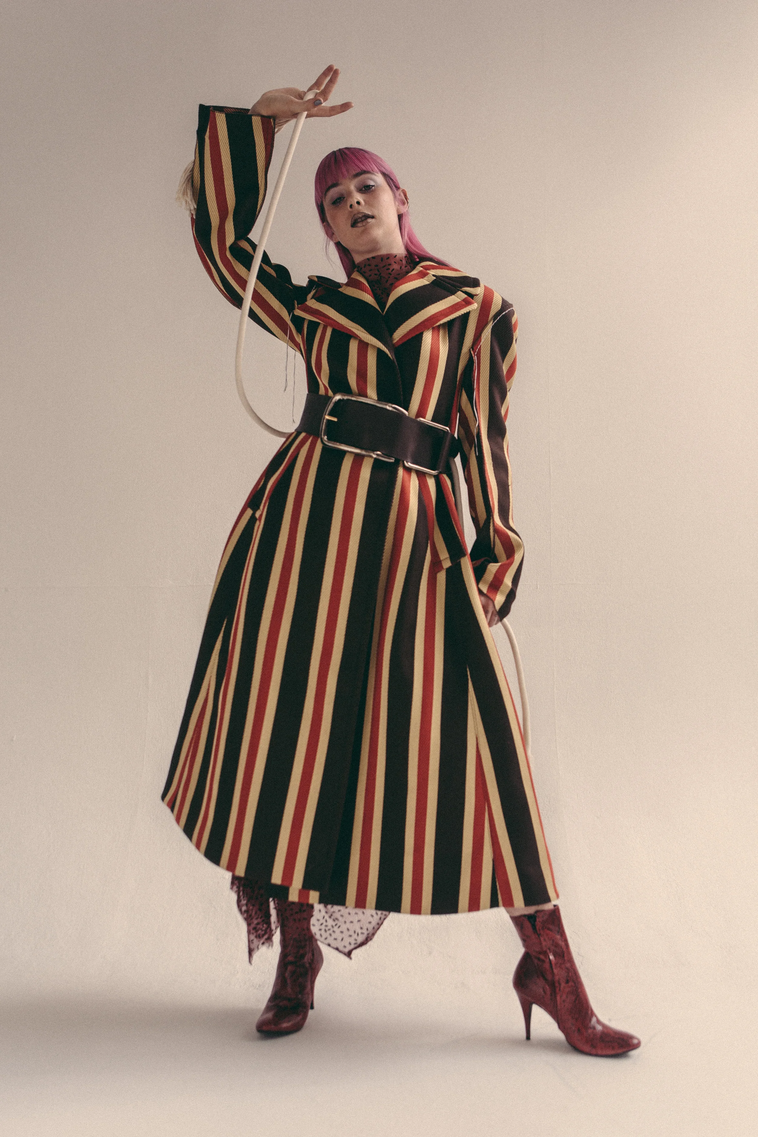 Dress by Paula Knorr , Coat and Belt by Marni , Boots by A.F. Vandervorst .