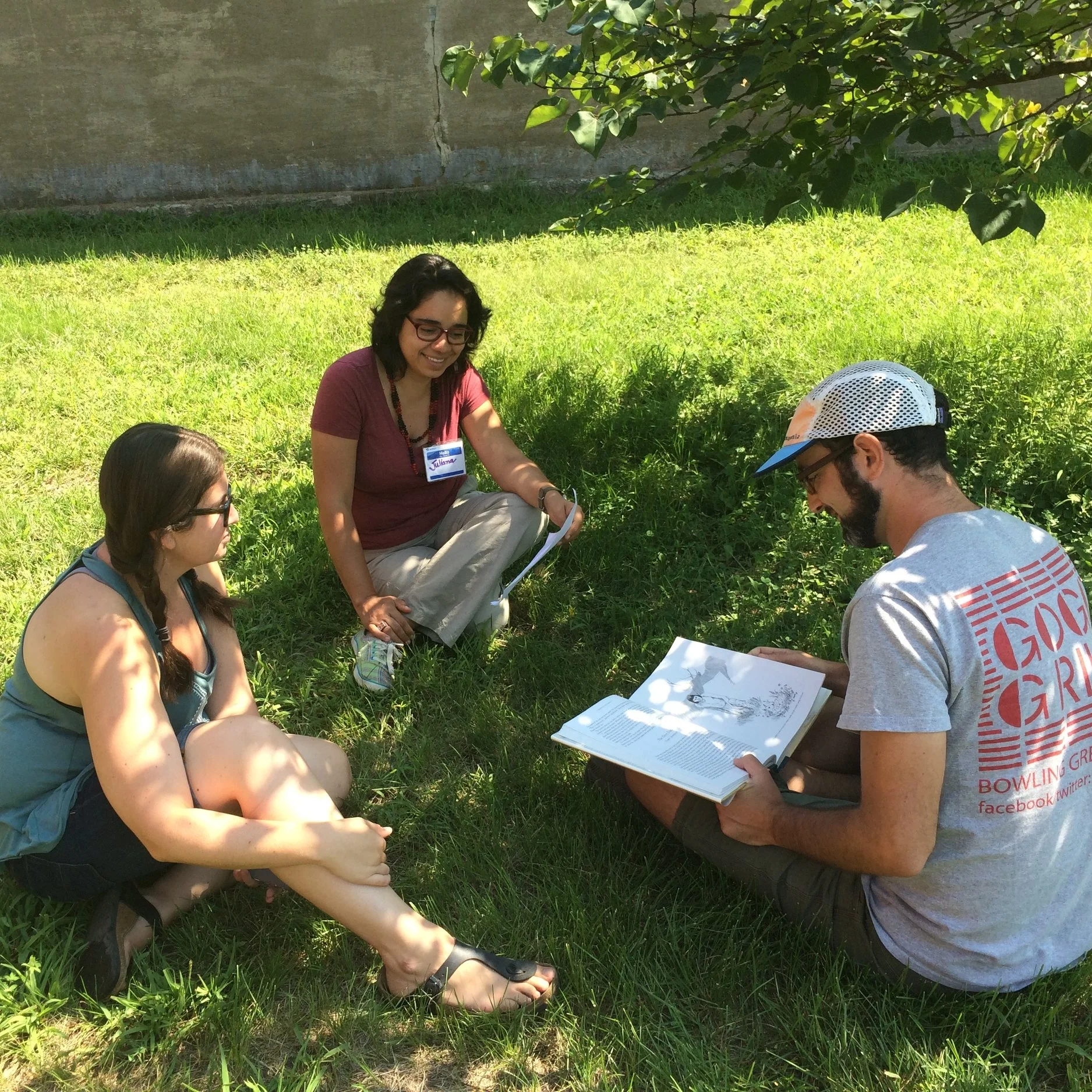 Jes (left), Juliana (middle), and Sam prepare to tell a story to the group.