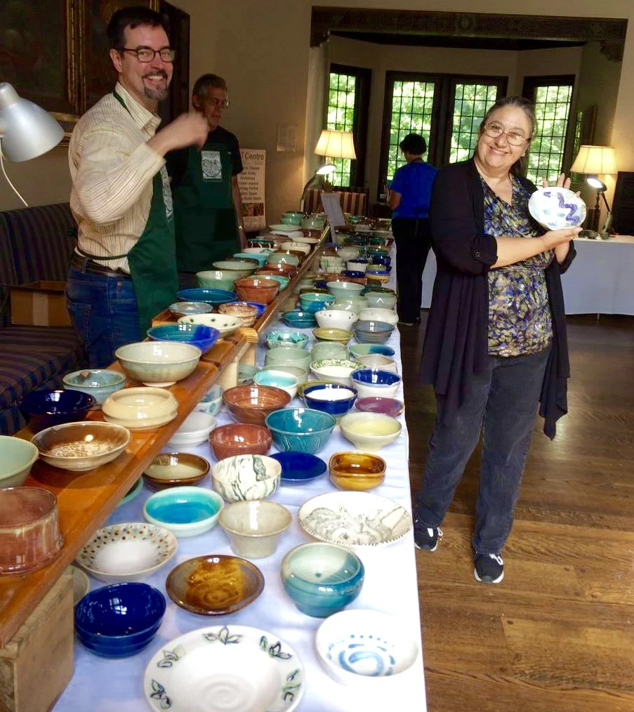 Karl and Cathy display the first round of bowls from which attendees can select.