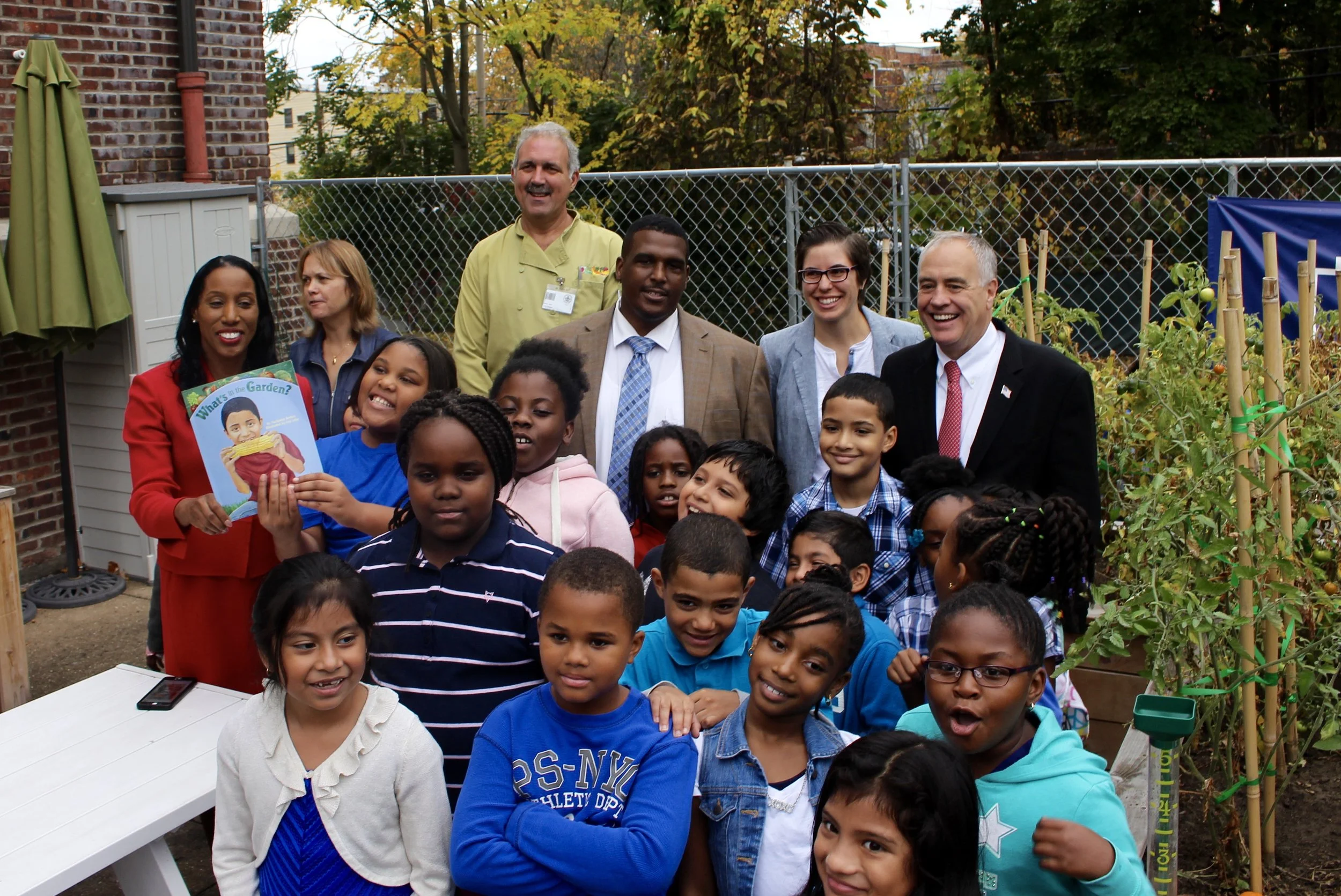 Clinton students show Mr. DiNapoli their school garden.