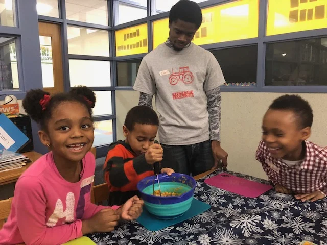 Krieger students in mash together chickpeas and sweet potatoes for a tasty hummus.