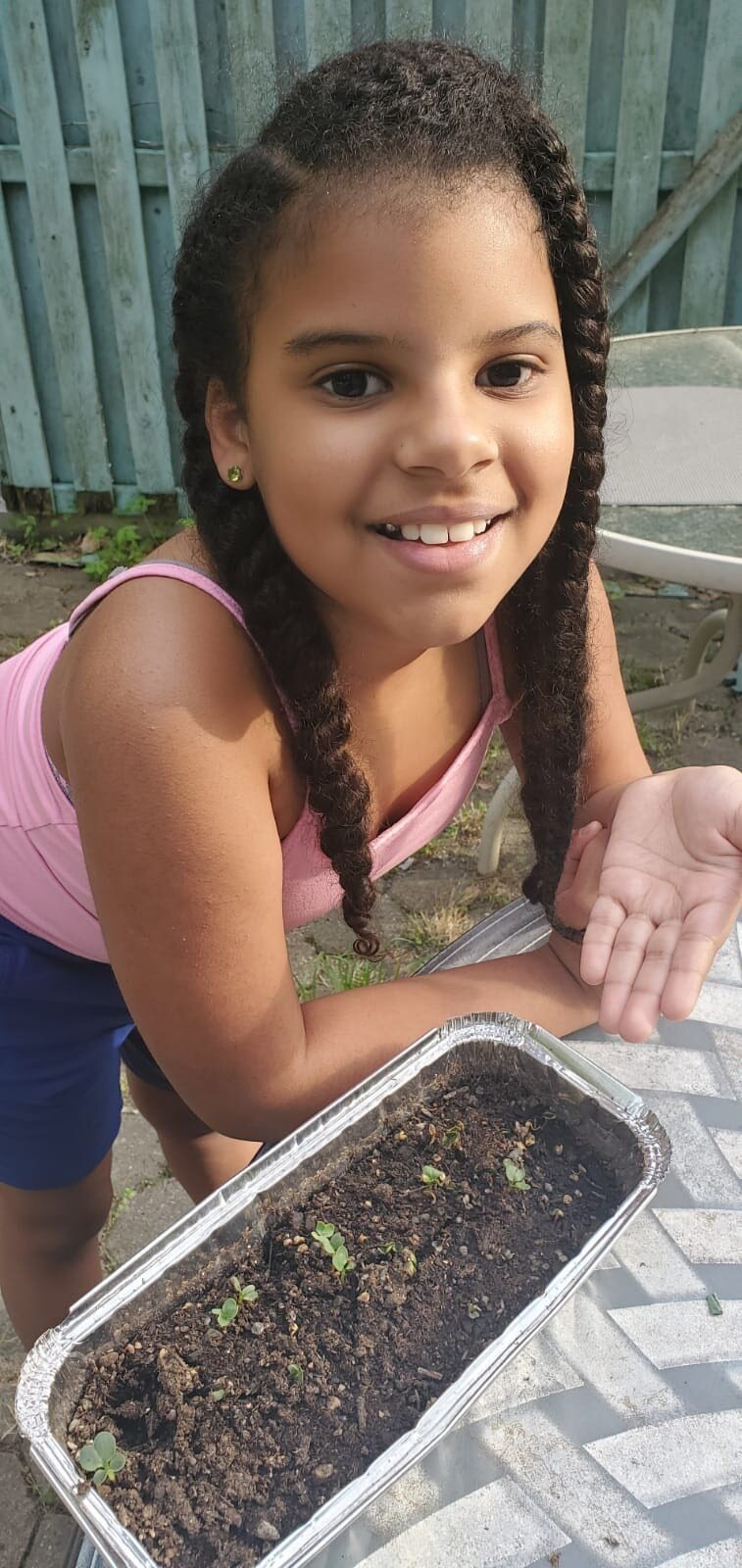 A student with their microgreens container 