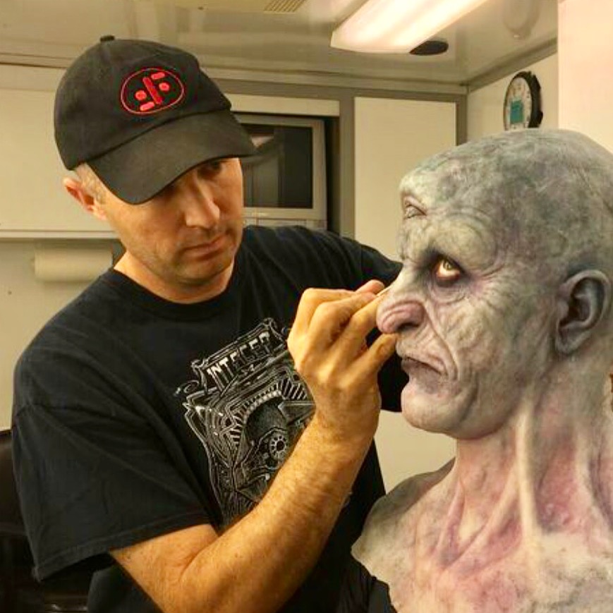 Clinton Wayne applying makeup on Stuntman Brady Romberg for Season 6 of Grimm.