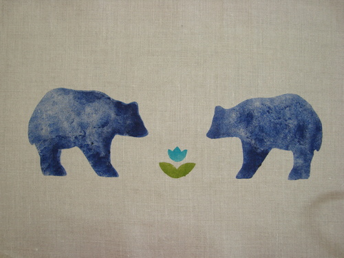 A pair of Cal bears enjoying the first flower of spring. The motif is in blue, teal and bright green on a Classic Cotton - Dove roller shade. The Cal Bear stencil is 13" wide. $42.00 per motif.