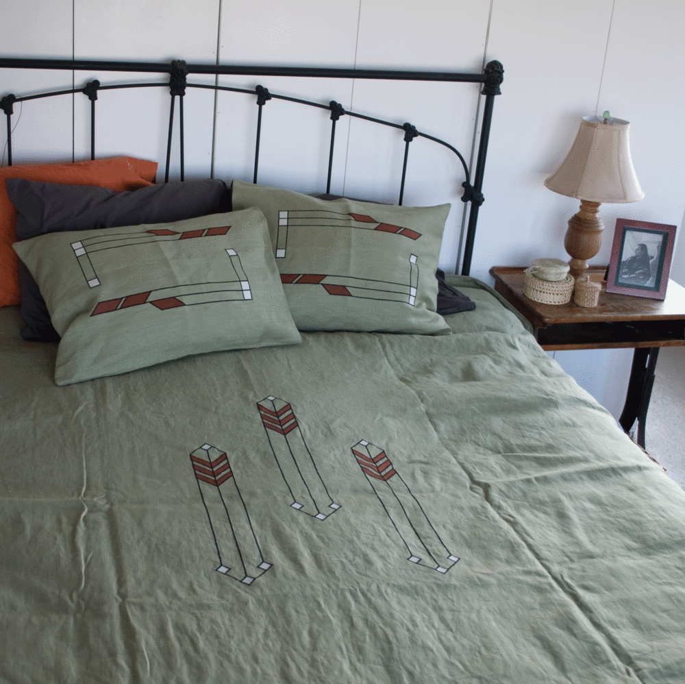 Above is a custom design of our geometric appliques Prairie Grass and Chicago on the pillows and bedspread. Fabric is in our custom color Peasant Linen - Sage.