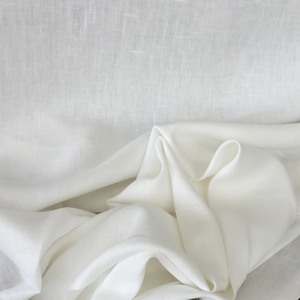 Handky Linen, Oyster: slightly off-white woven with a fine thread so that it can support applique or Roman shade structure. Should not be lined, 55" wide. $25.00 per yard.